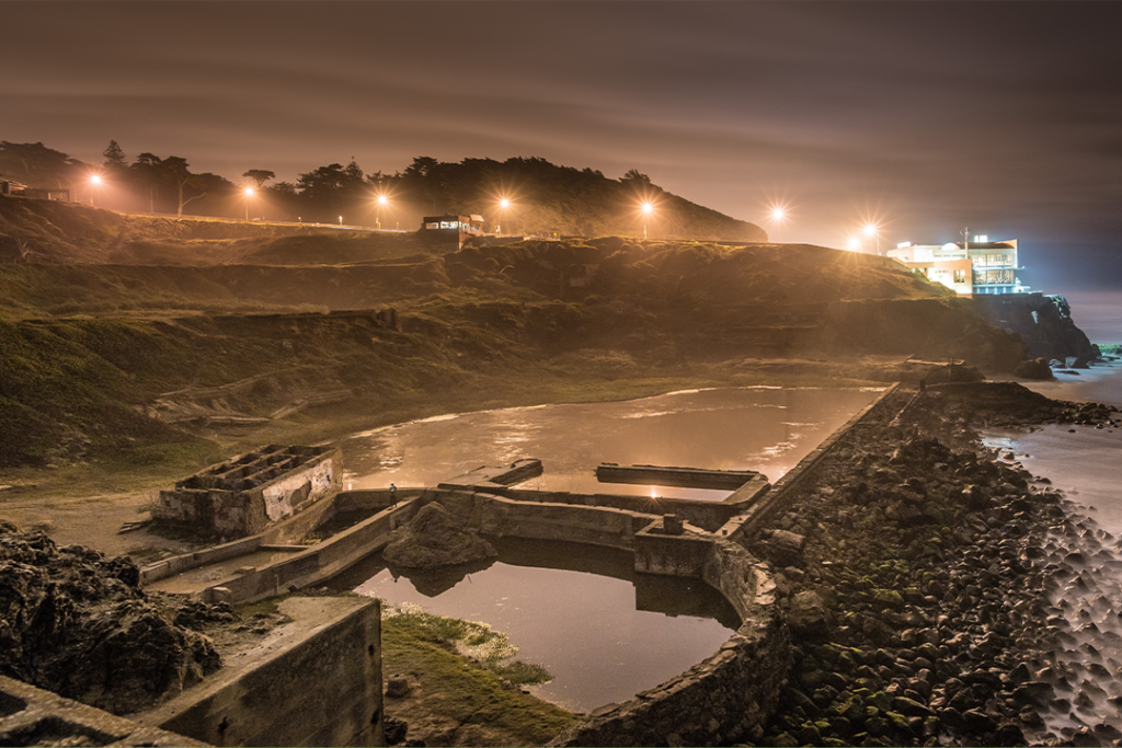 Sutro Baths Ruins with a Distant House in San Francisco at Night