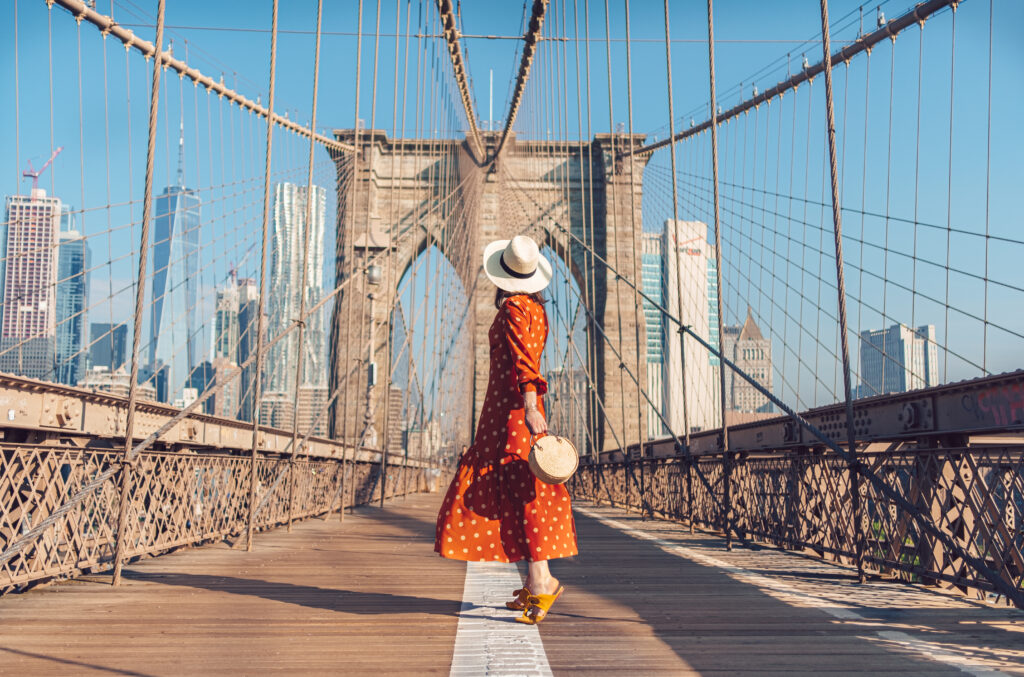 Woman in red dress on Brooklyn Bridge