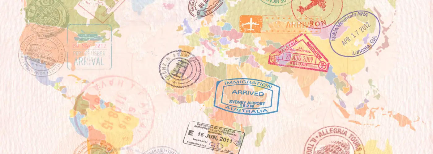 World map covered in passport stamps