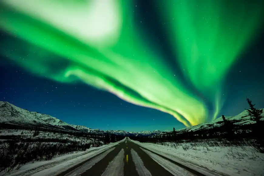A long exposure lets the camera capture movement of ribbons aurora in denali