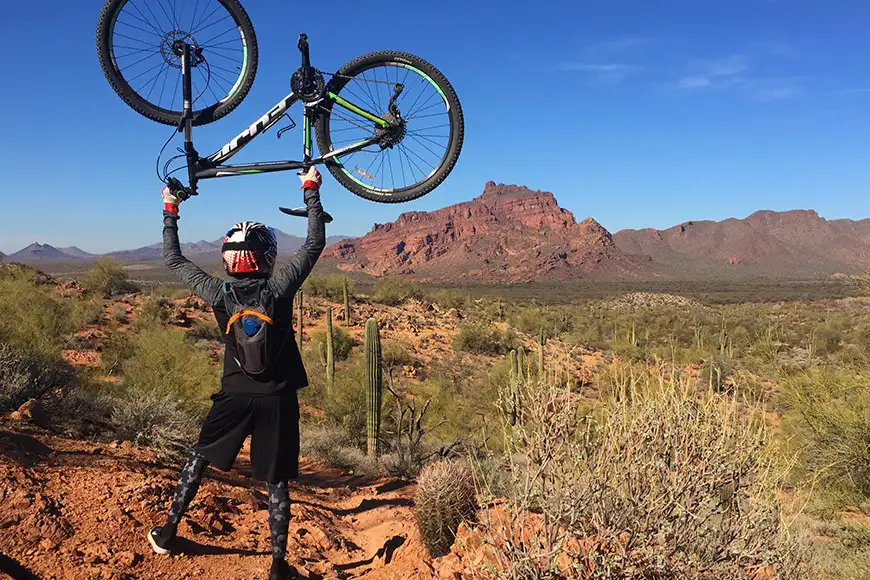 Man holds a bike in the air phoenix arizona