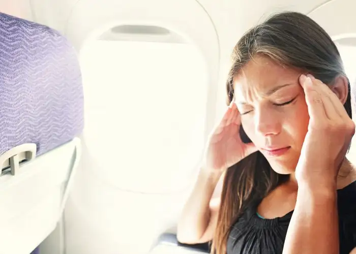 Women on plane feeling sick