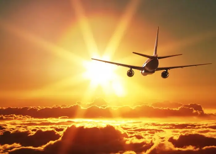 Transatlantic Flights Airplane Nondescript Flying Off Toward Sunset