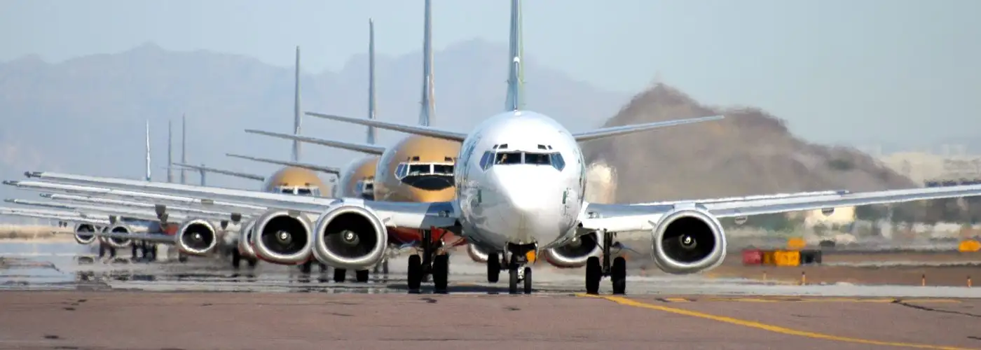 Airplane - Nondescript Row of Planes Airfare Sales