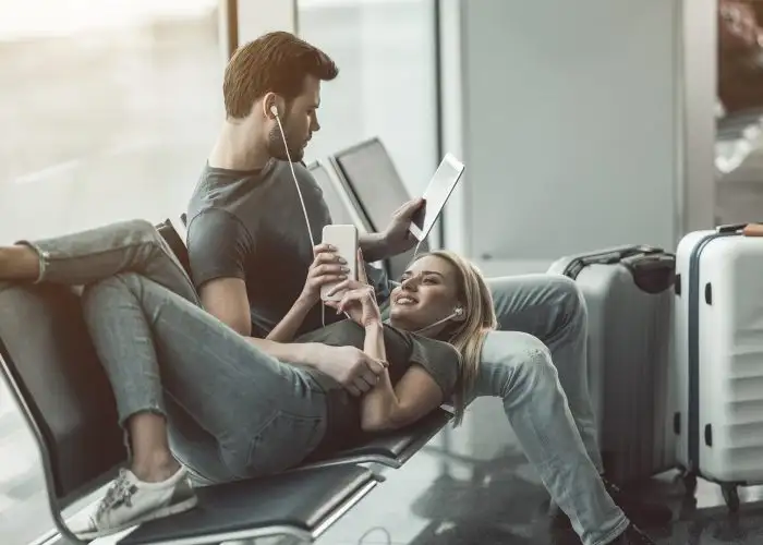 couple reading at airport