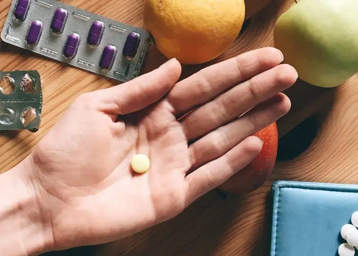 hand holding pill