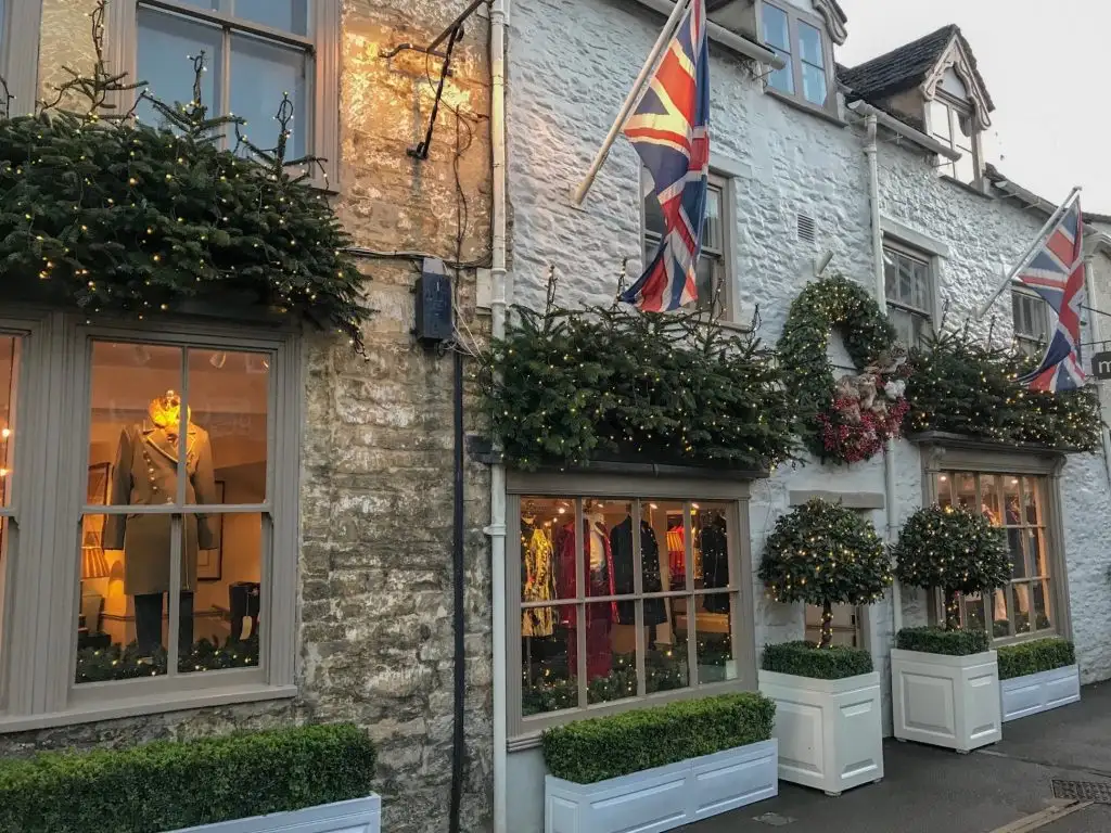 old english stone store front decorated for christmas