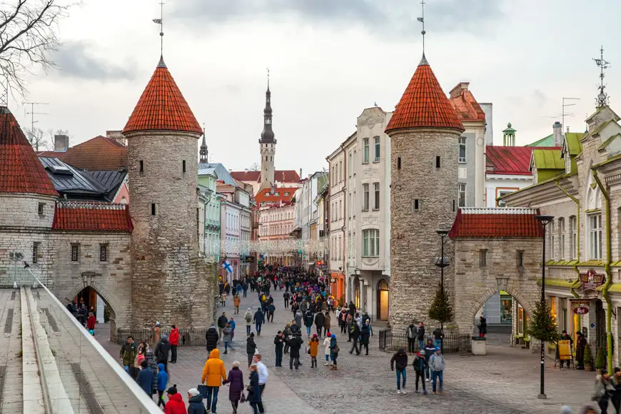 People are walking on Viru street at Viru gates in Tallinn, Estonia