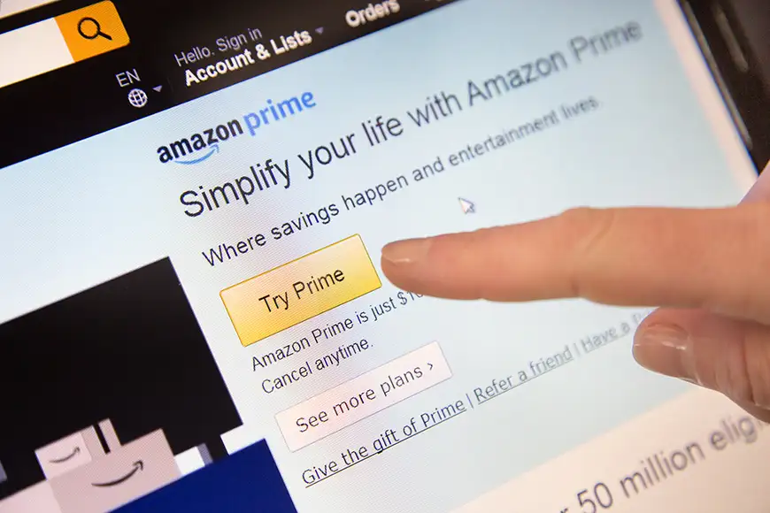 Amazon sign in page of website with a finger touching the screen