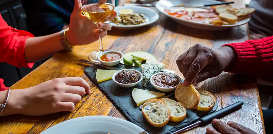 people sharing an appetizer at amada.