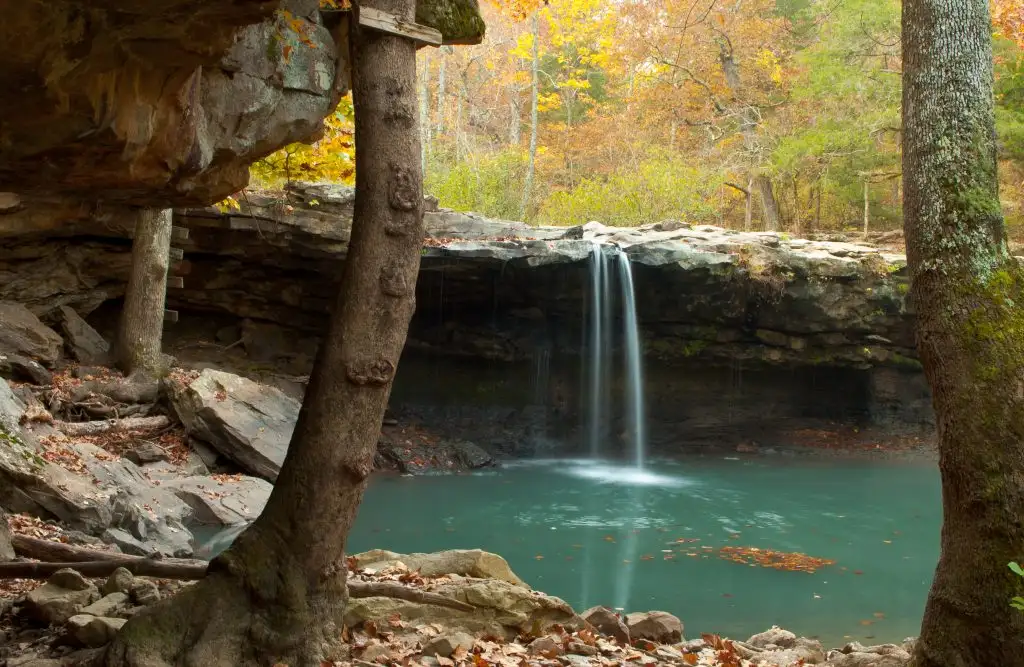 waterfall and swimming hole in forest autumn