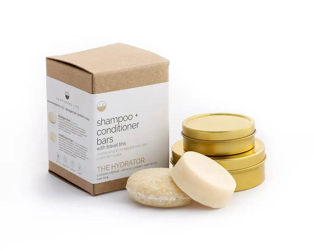 Unwrapped shampoo + conditioner bar travel set with tins