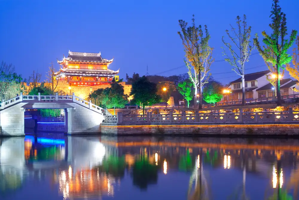 bright lights over suzhou canal in china at night.