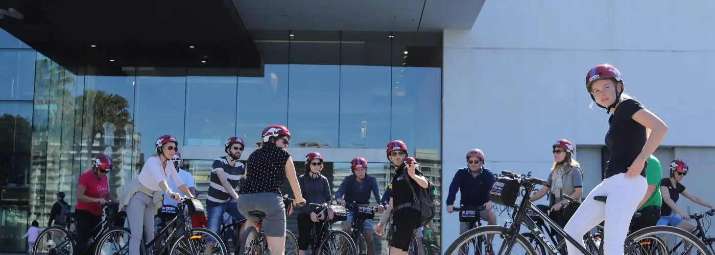 Group of cyclists wearing helmets.