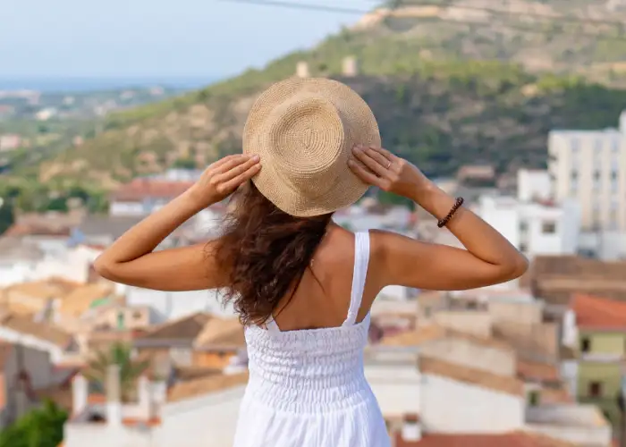girl wearing hat on vacation.