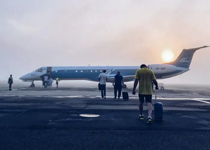 man boarding airplane jet early morning