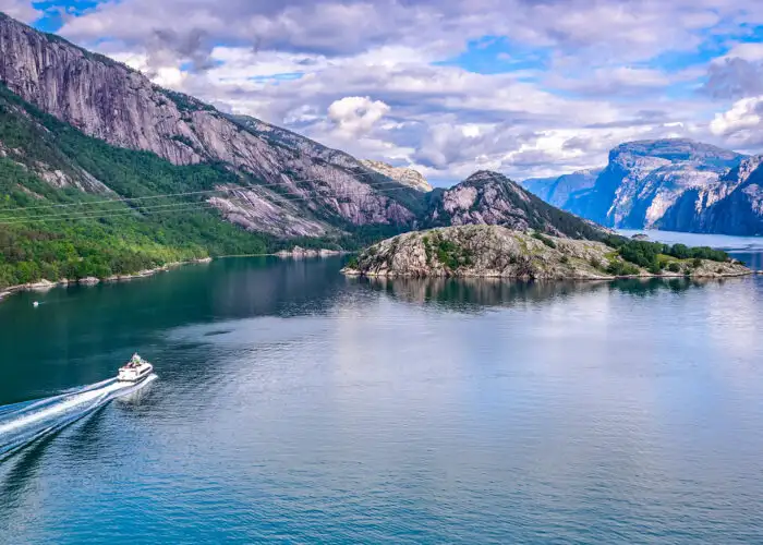 wide angle view of boat in norway fjords.