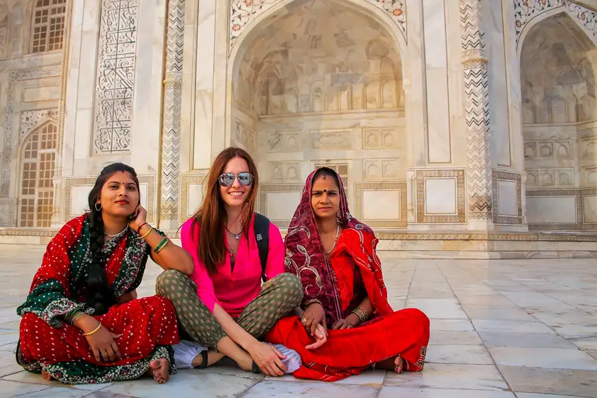 Unidentified women sit outside Taj Mahal in India
