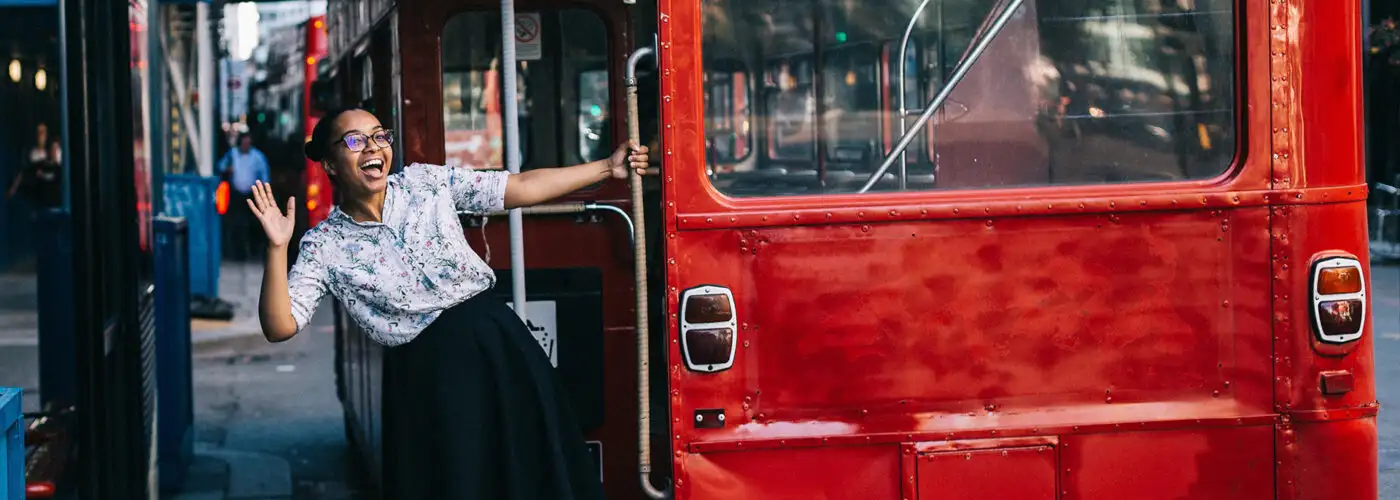 woman hopping on london bus