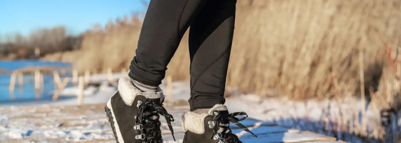 woman in tights and sneakers in winter.