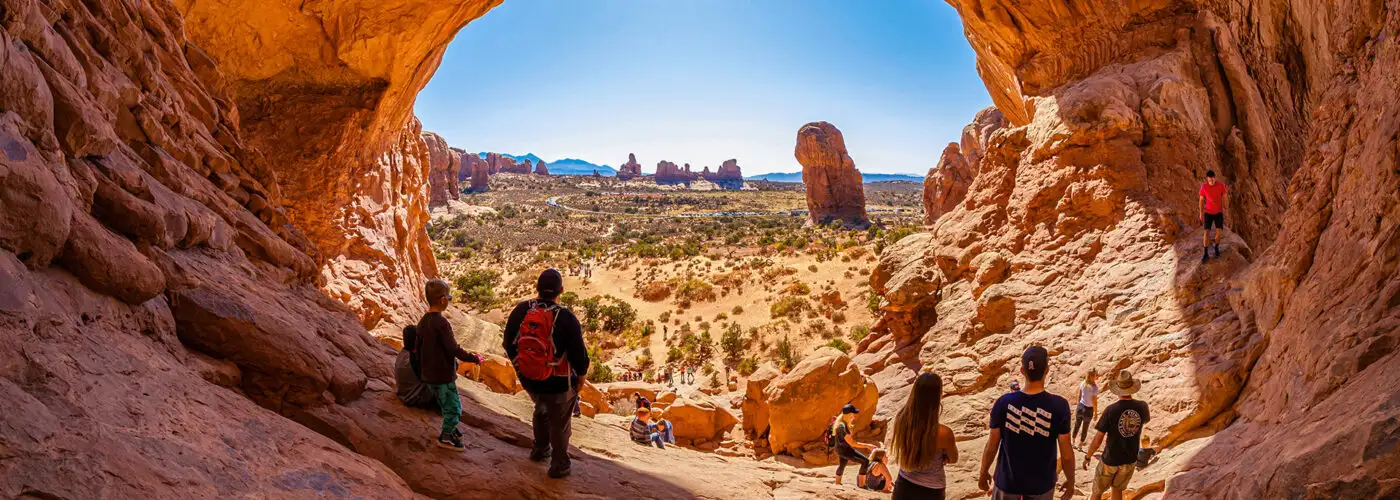 Moab, Utah USA - October 19, 2019: Tourists enjoying the natural beauty of the Double Arch in Arches National Park.