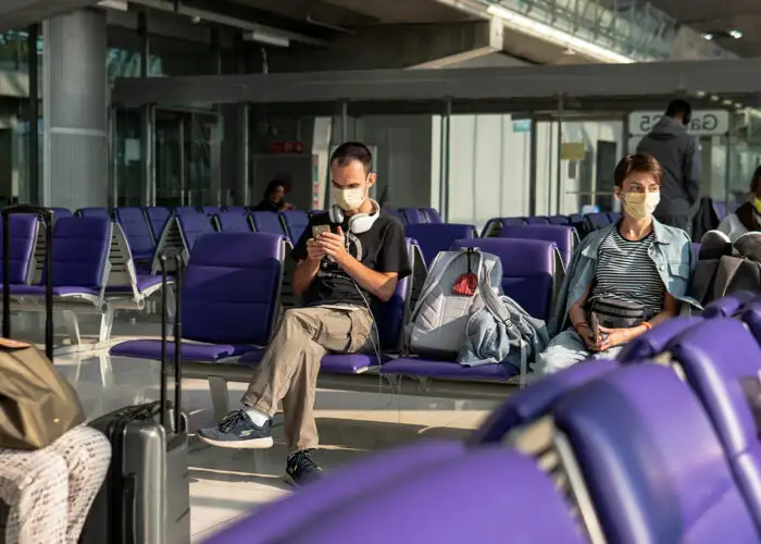coronavirus pandemic COVID-19 in airports. Quarantine and protective measures to stop the spread of the virus around the world.