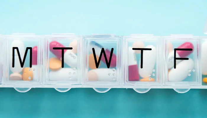 Pill organizer on a blue background