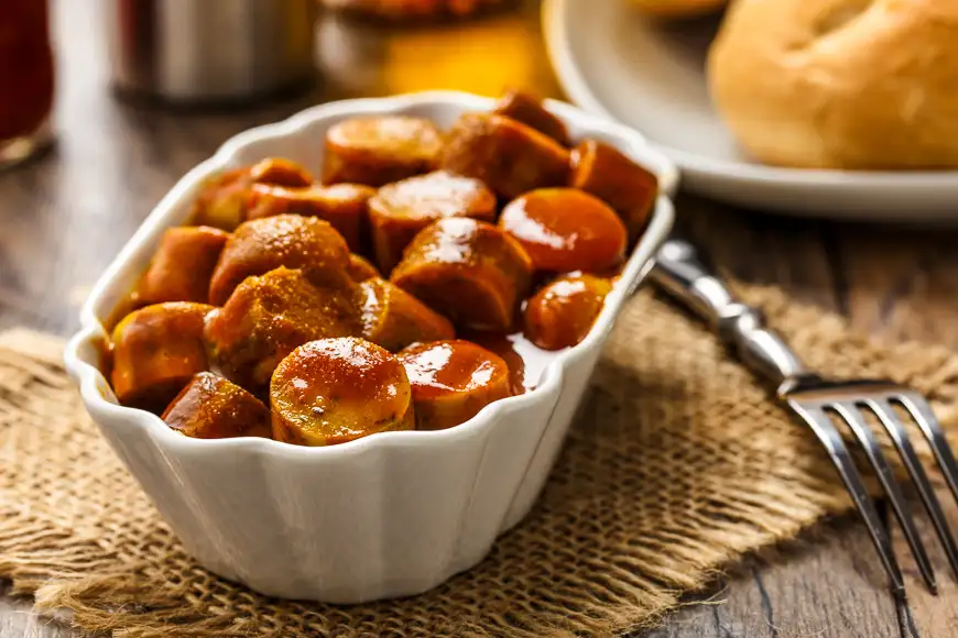 german currywurst - pieces of curried sausage