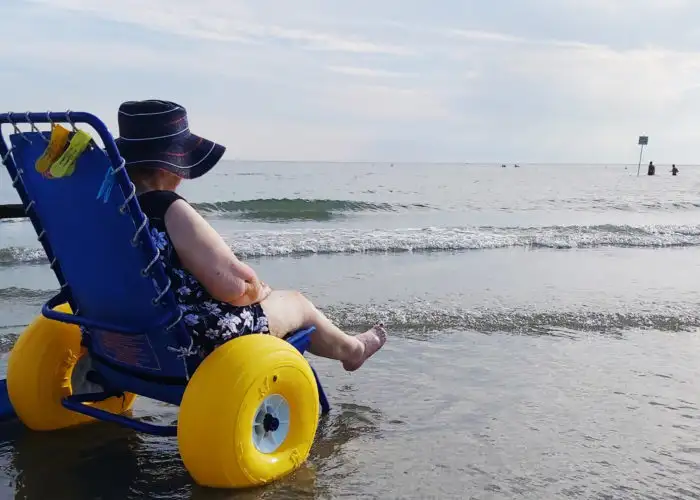 Woman in beach wheelchair