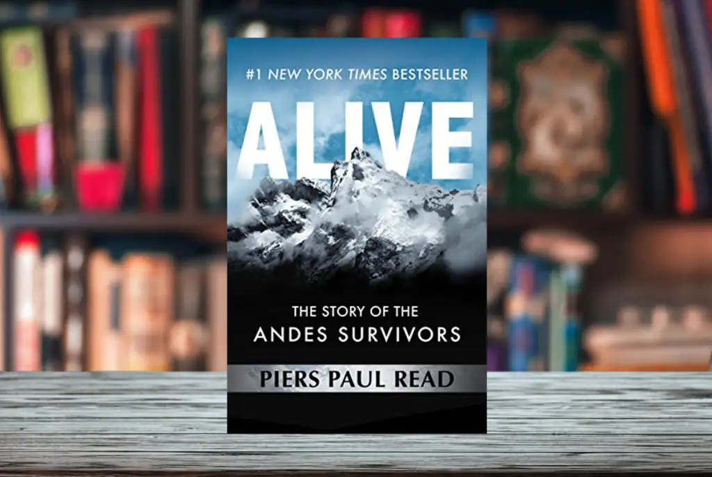Cover of Piers Paul Read's book Alive superimposed on a bookshelf with shelves of books in the background