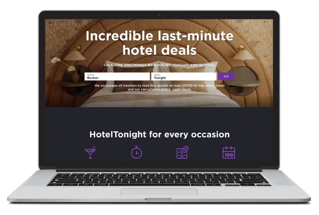 An open laptop showing the homepage of HotelTonight, a travel website where you can make last minute hotel reservations