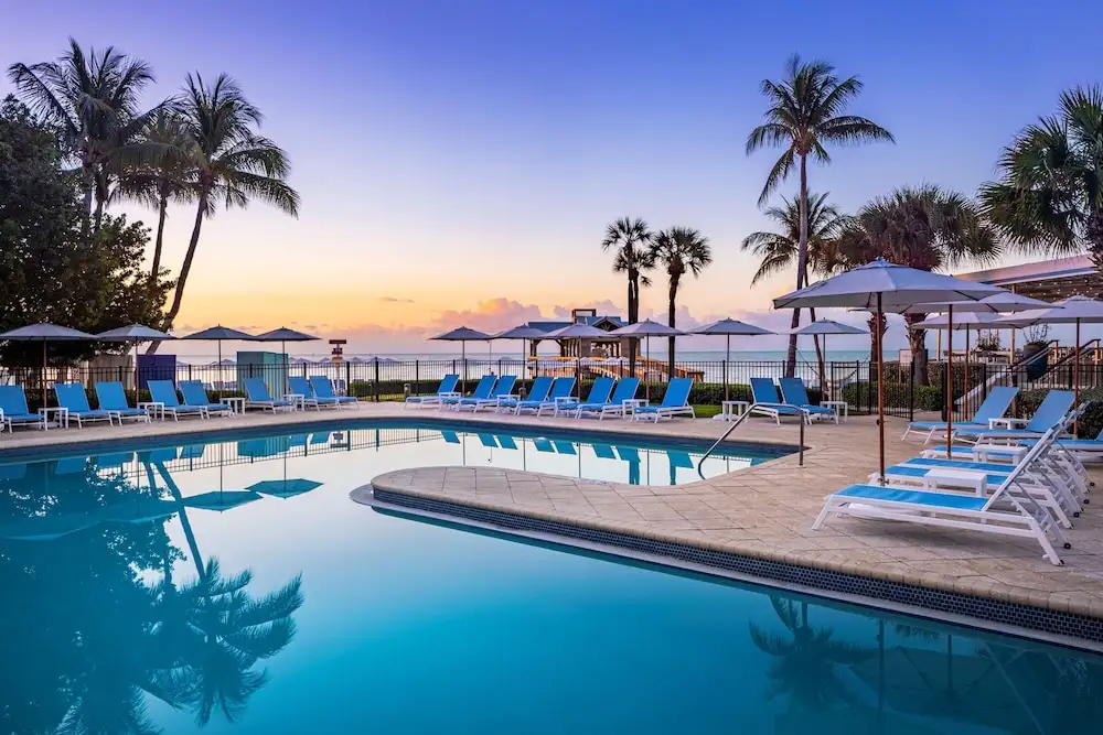 Lounge chairs by the pool at The Reach Key West Curio Collection by Key West