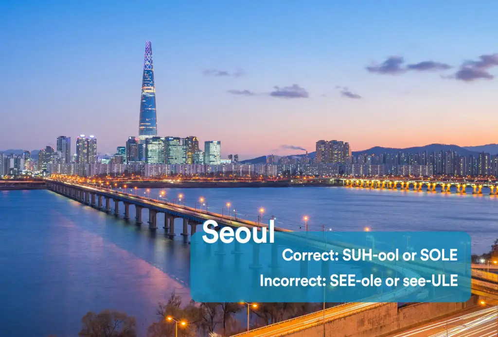 City skyline of Seoul, South Korea with road leading into the city with graphic overlay showing the correct and incorrect way to pronounce "Seoul"