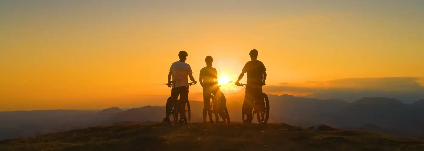 Silhouette of bikers at sunset