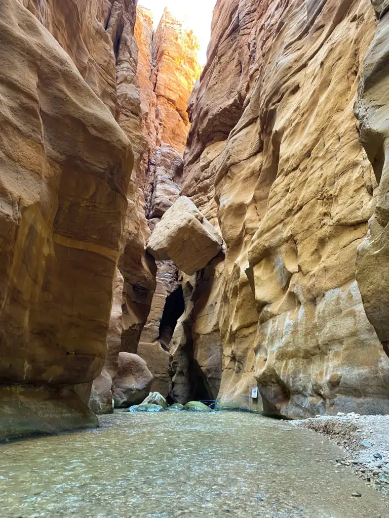 River running between two cliffs at Wadi Mujib in Jordan