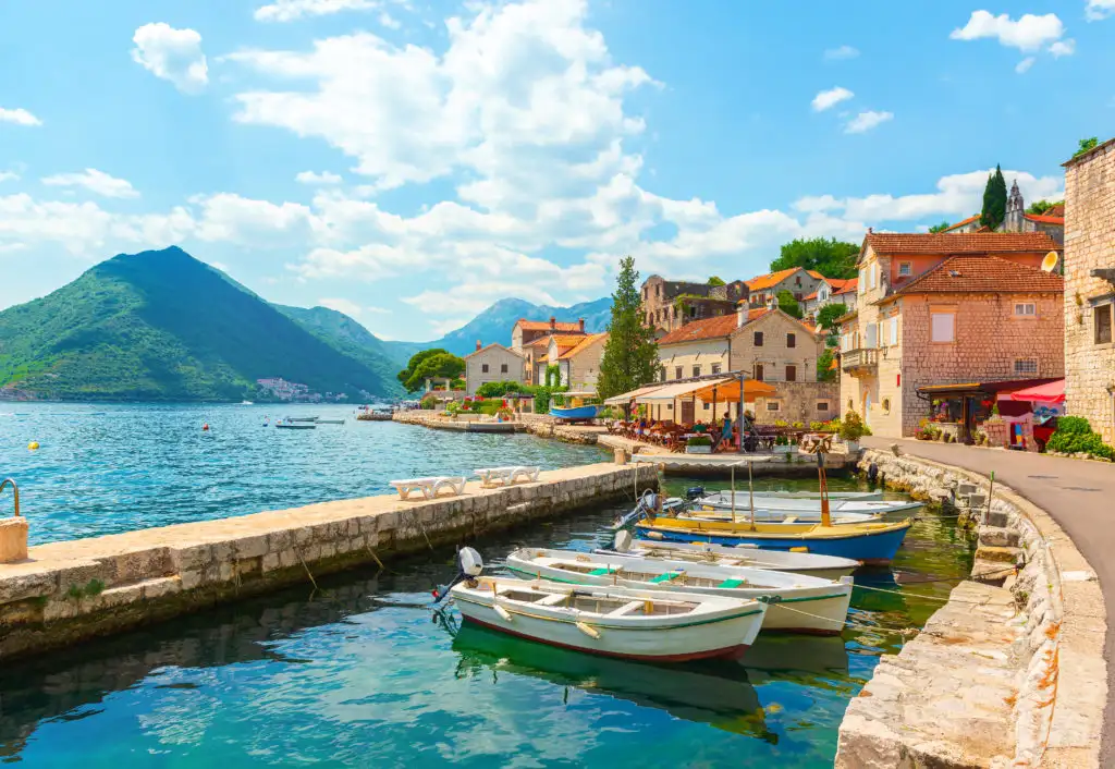 City Perast in Montenegro, overlooking the ocean on a sunny day