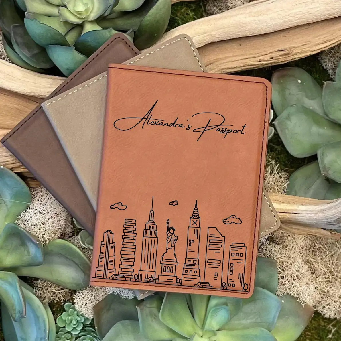 Personalized passport holder on a bed of plants