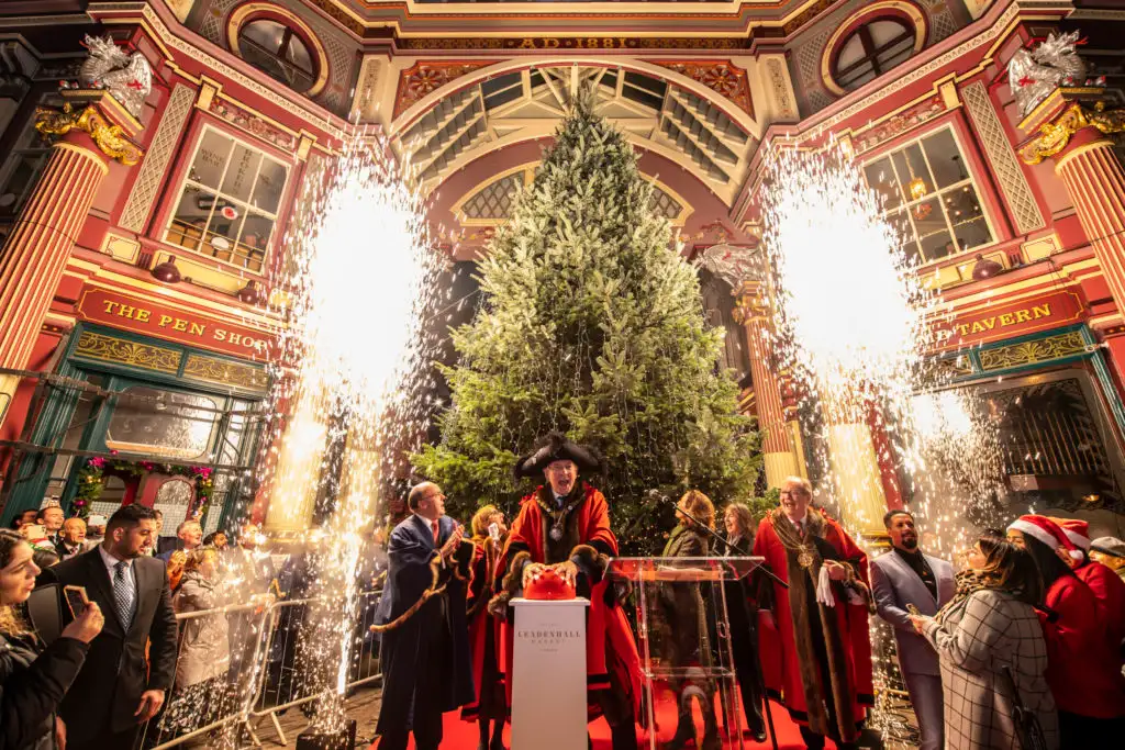 The Lord Mayor of London switching on the holiday lights at the annual ceremony in Leadenhall Market, one of the oldest markets in the city.