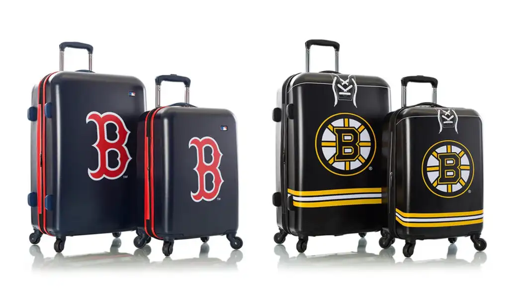 Two sets of luggage with the Boston Red Sox and Boston Bruins logos on them