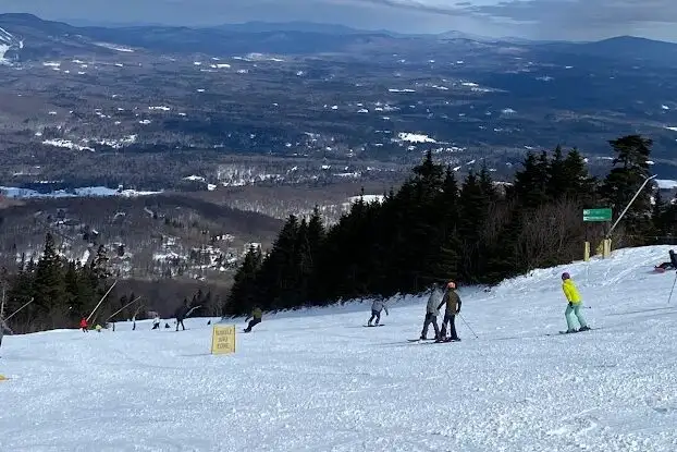 Skiers skiing down Stratton Mountain in Vermont