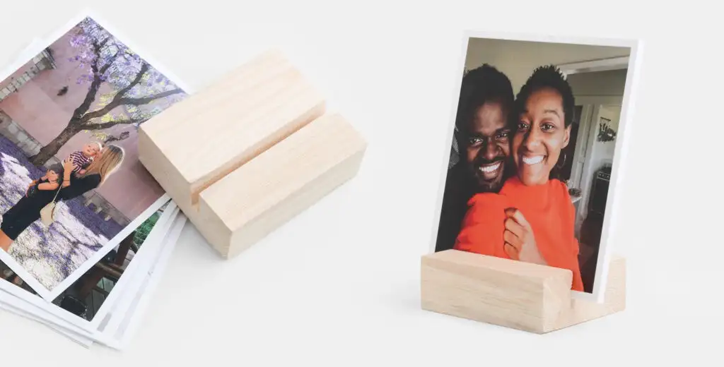 Cardstock photo prints and wooden photo holders from Artifact Uprising