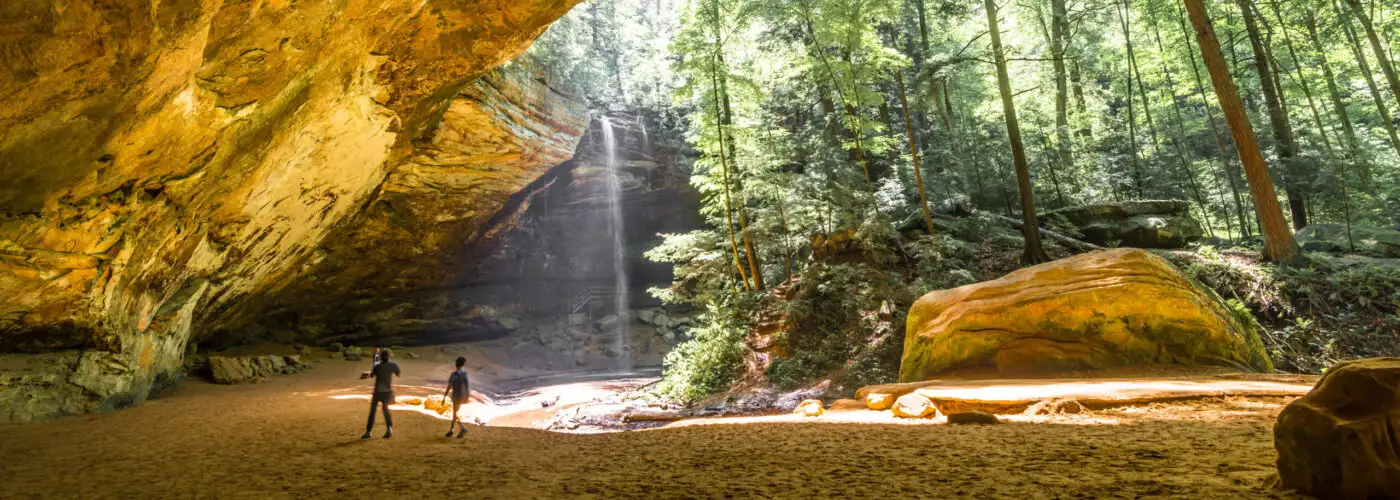 Two kids playing in Ash Cave in Hocking Hills State Park