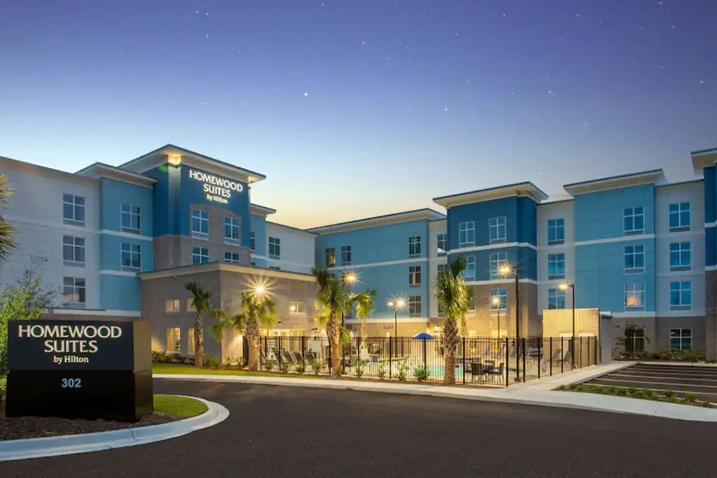 Front entrance of the Homewood Suites by Hilton Myrtle Beach Coastal Grand Mall at dusk