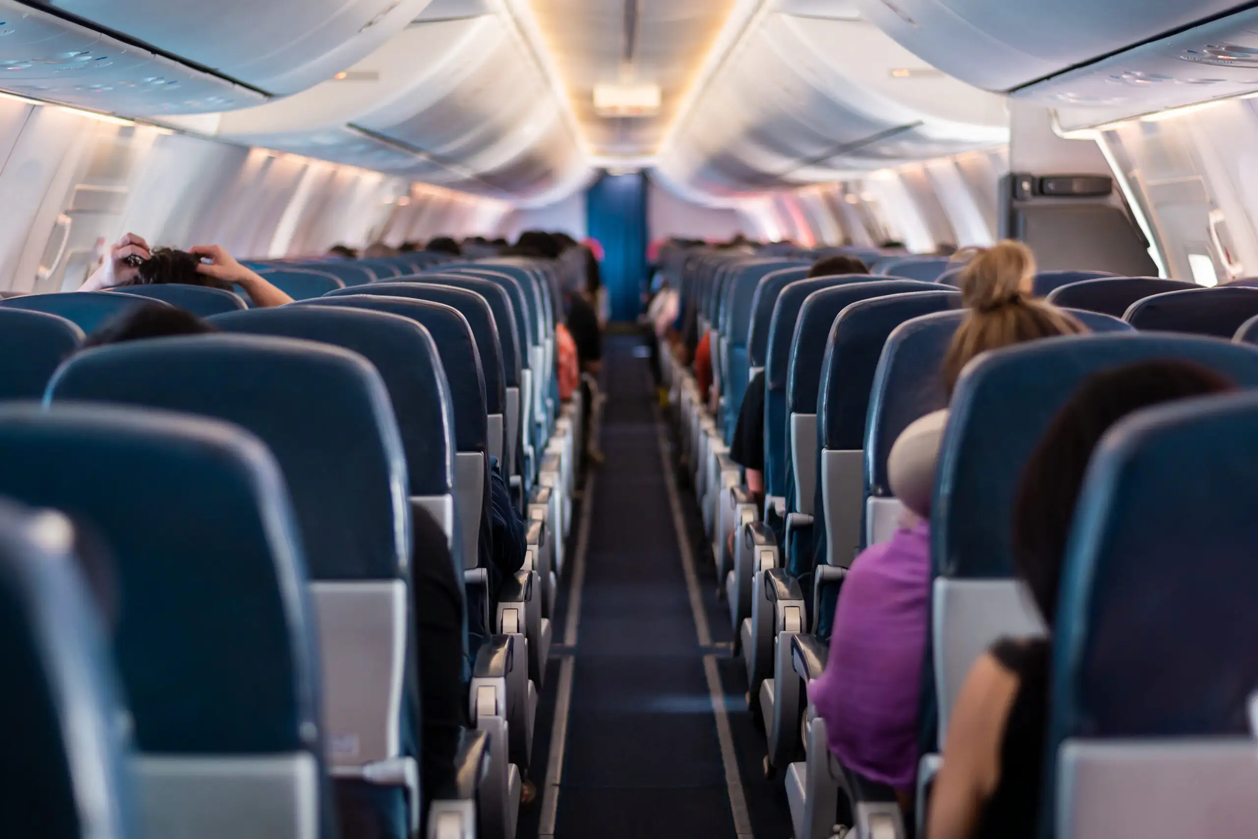 View from the rear of a plane full of passengers