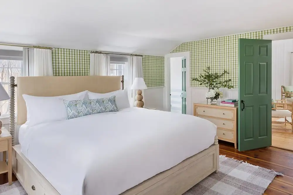 A cozy green guest room at White Elephant hotel on Nantucket, Massachusetts