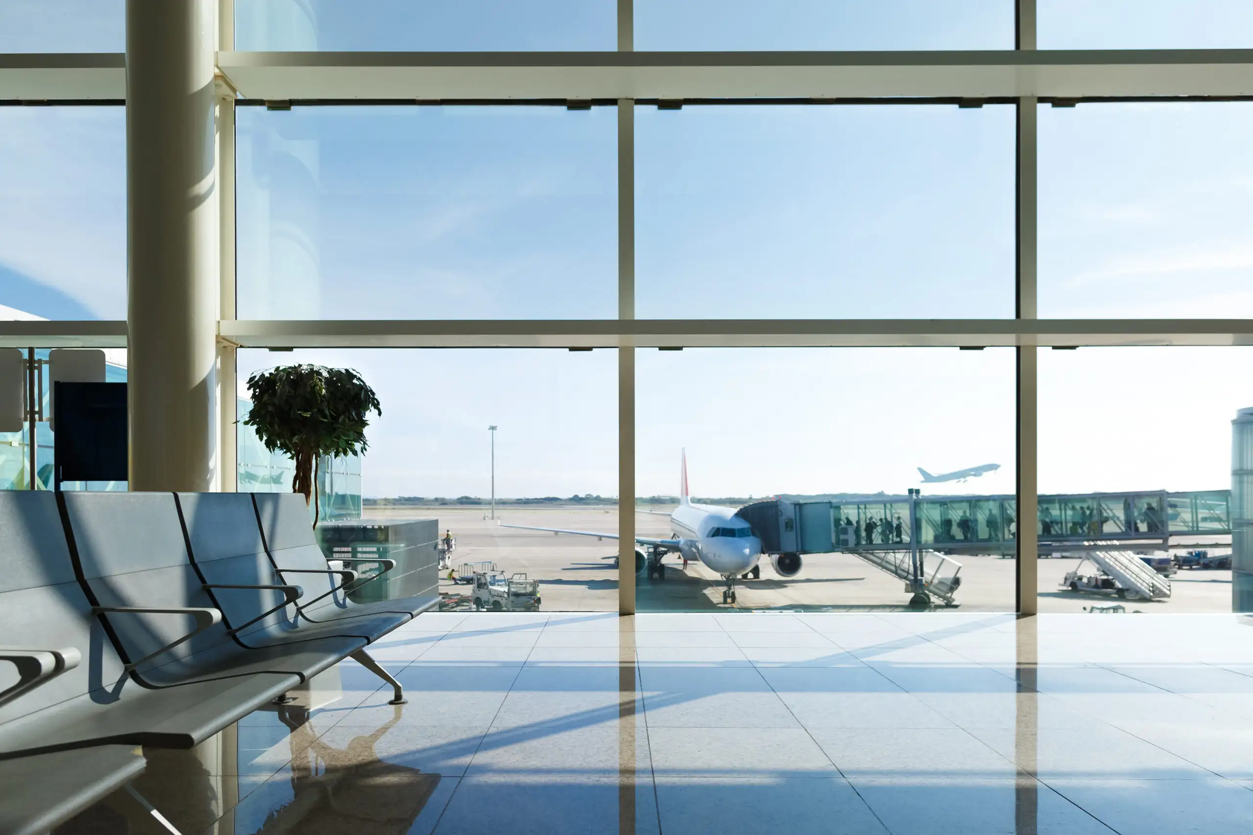 Empty airport terminal with large window