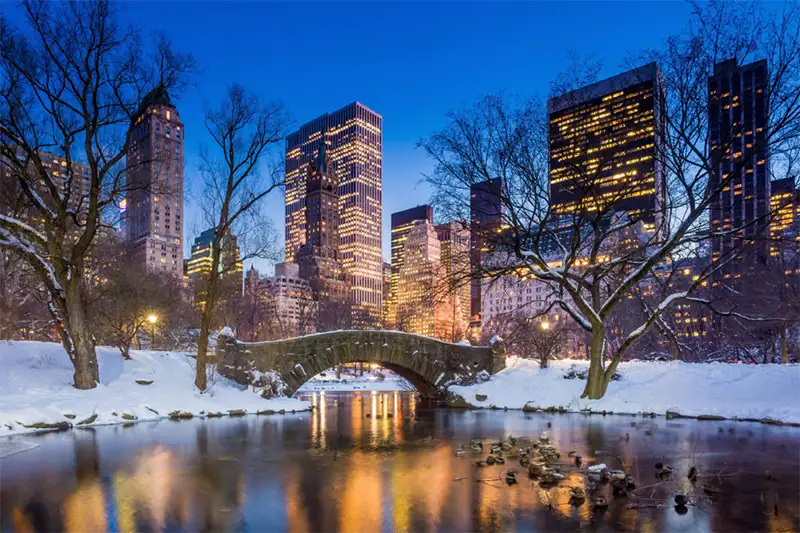 New York City in winter at dusk as seen from Central Park, one of the best December travel destinations