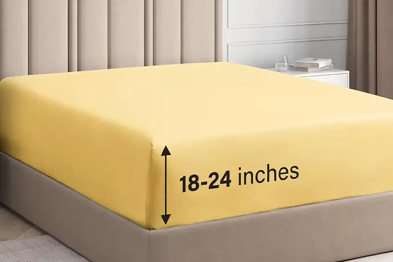 Bed made up with yellow Extra Deep Cal King Fitted Sheets