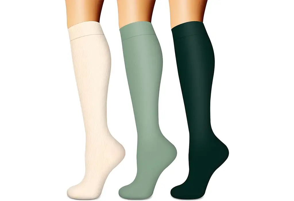 White, green, and black compression socks