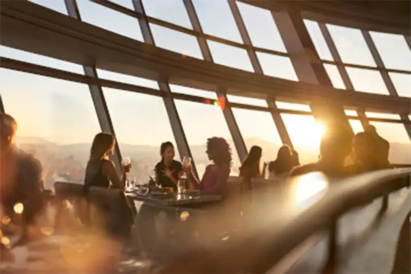 People enjoying drinks and a meal on the observation deck at Stratosphere Tower, Las Vegas